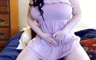 Curvy dolled up gal teases slit with sex tool